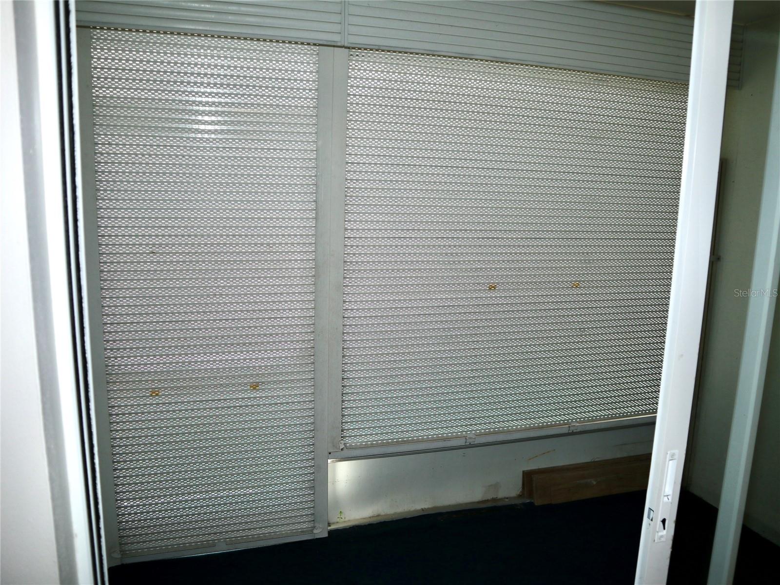 Integrated Hurricane Shutters in Florida Room