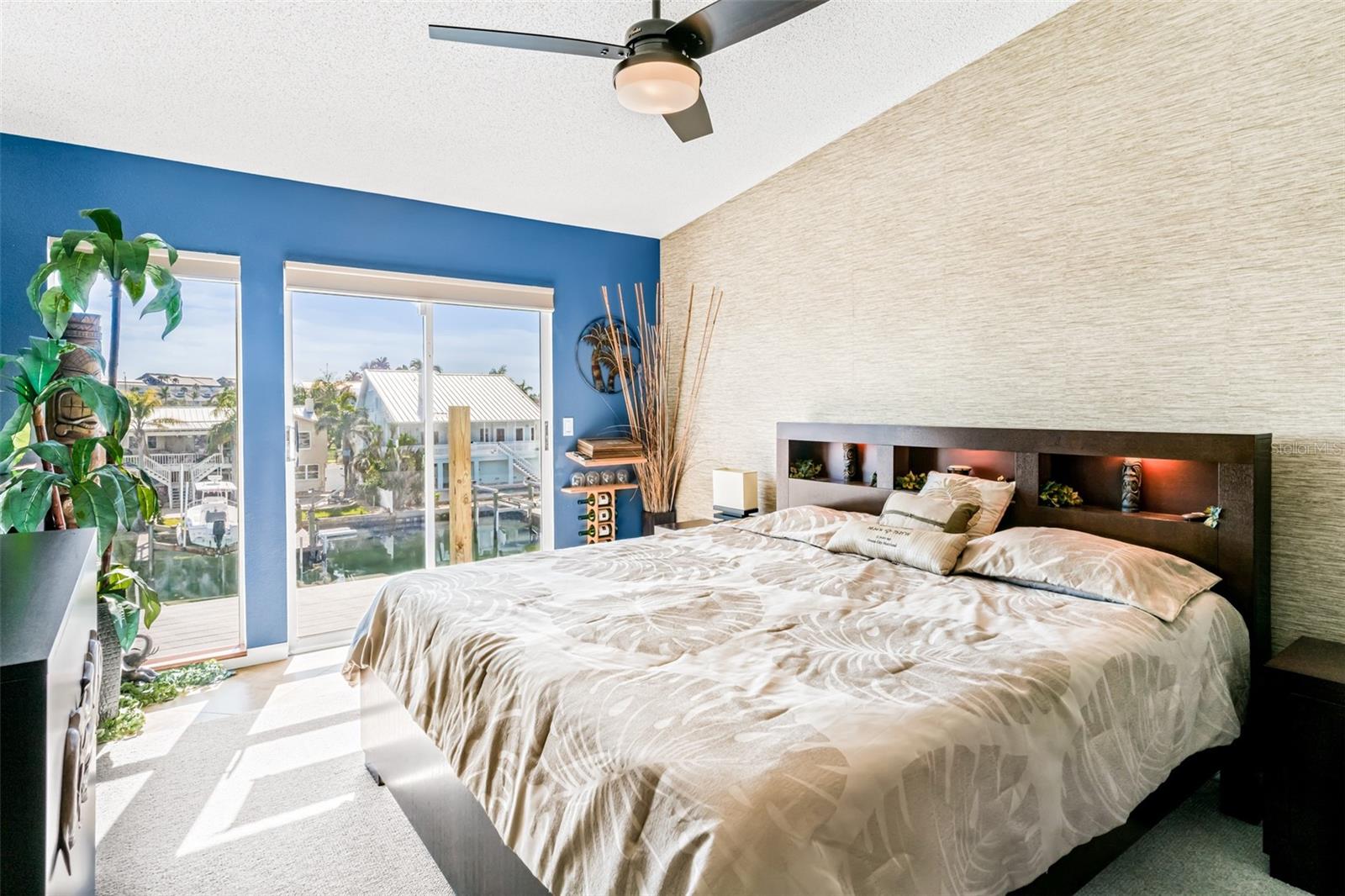 Primary Bedroom with balcony access and water views