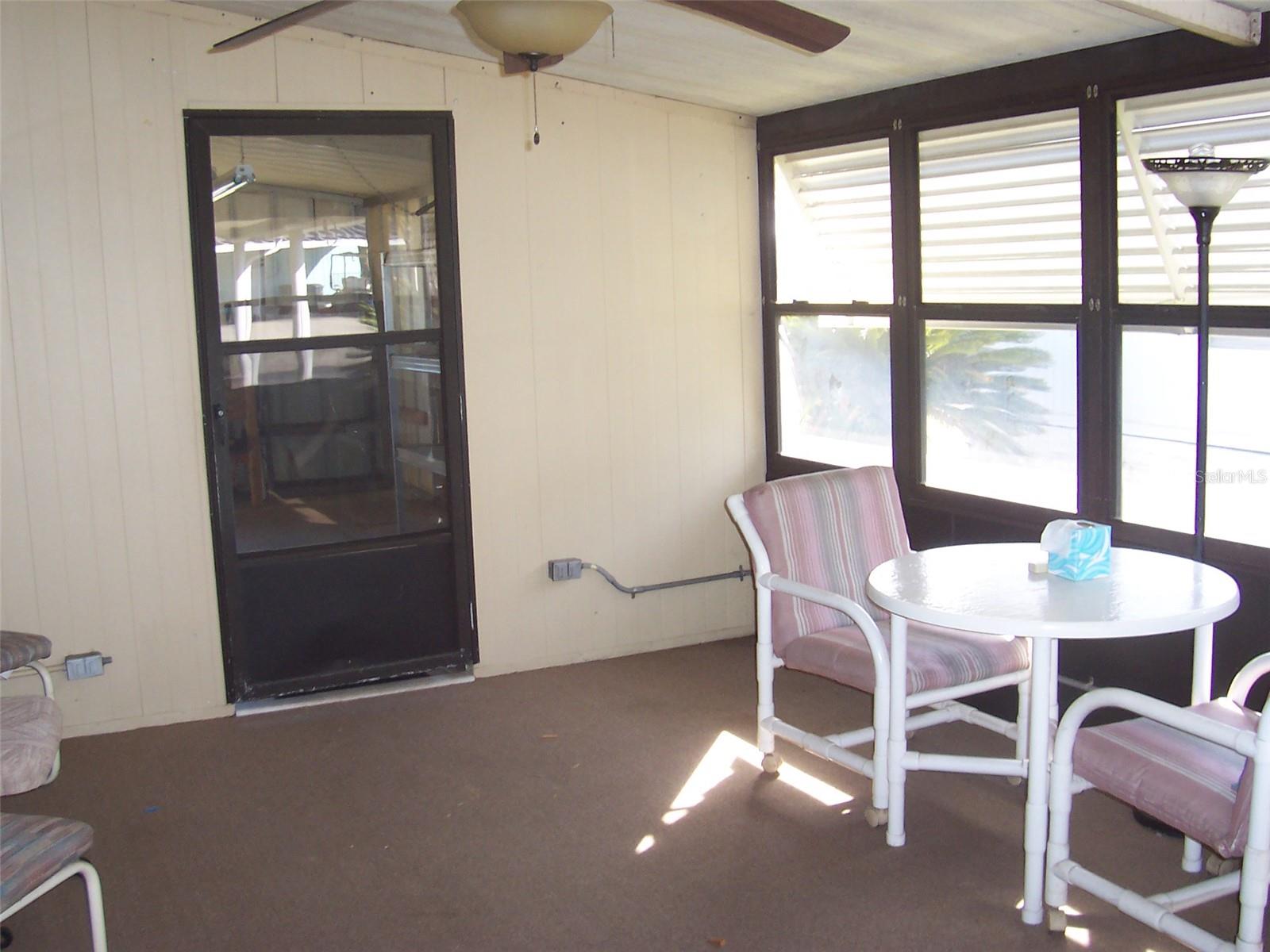 This door enters into the 17 x 11 laundry/workshop area.