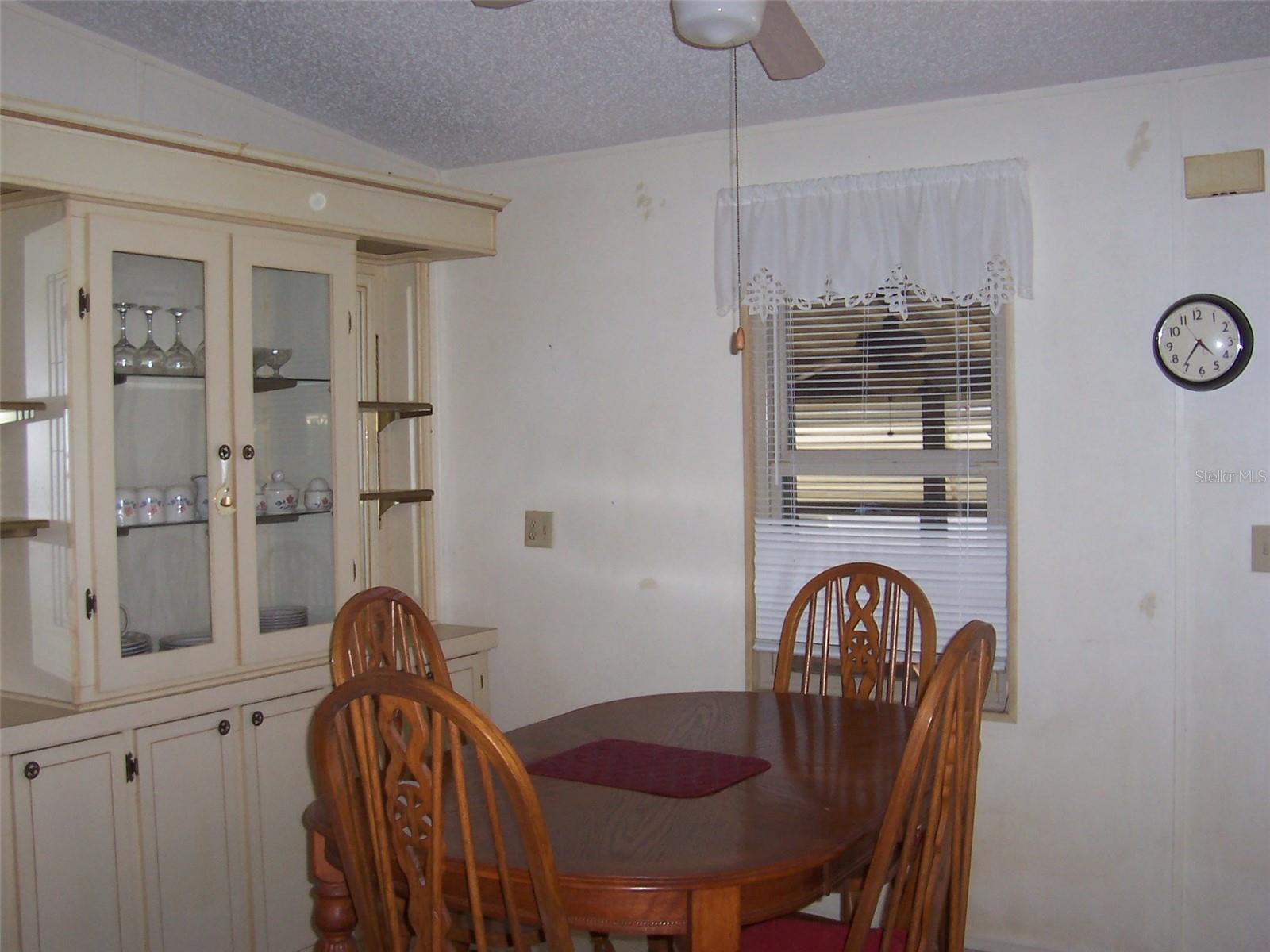 Dining Room featuring built in china cabinet for displaying those special dishes.  Loads of cabinets shelves and cabinets underneath as well.  Plenty of storage.