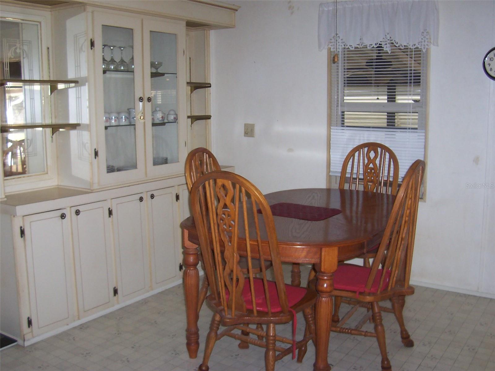 Dining room is conveniently located close to kitchen area.