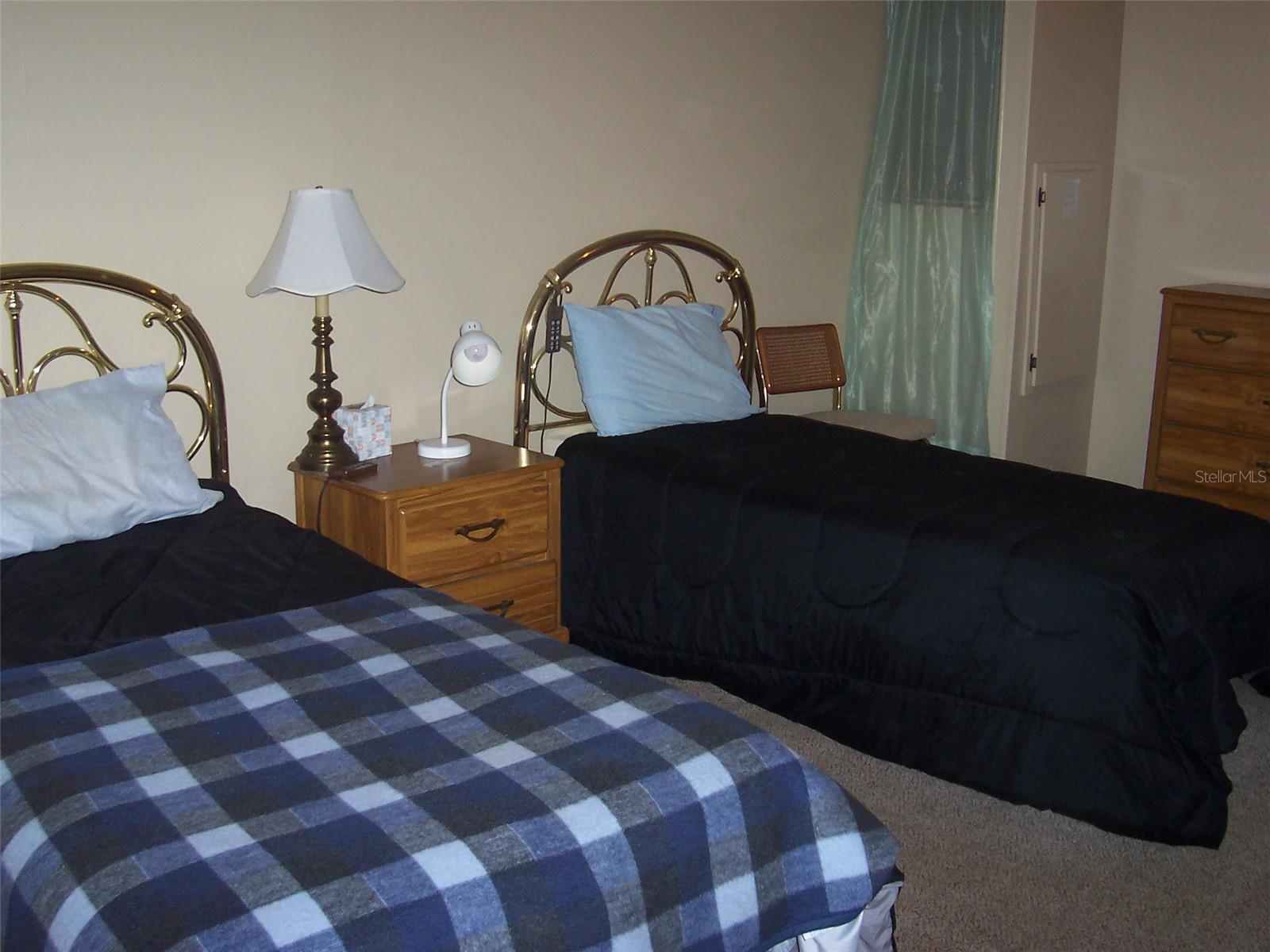 Showing the 2nd bedroom accommodating 2 twin beds and plenty of room to spare.