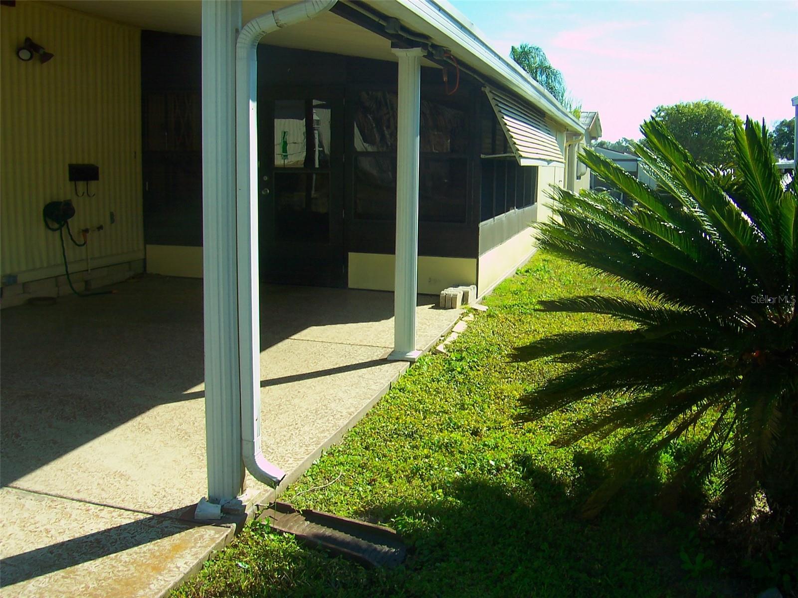 Fluted columns accent the carport.