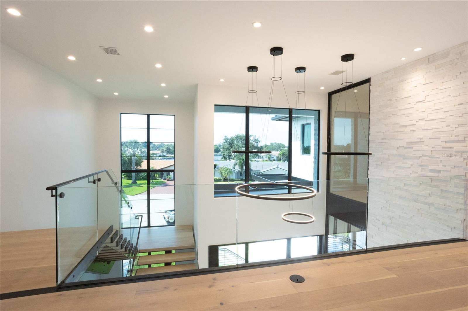 Seamless glass at the top of stairs for a sleek and modern look