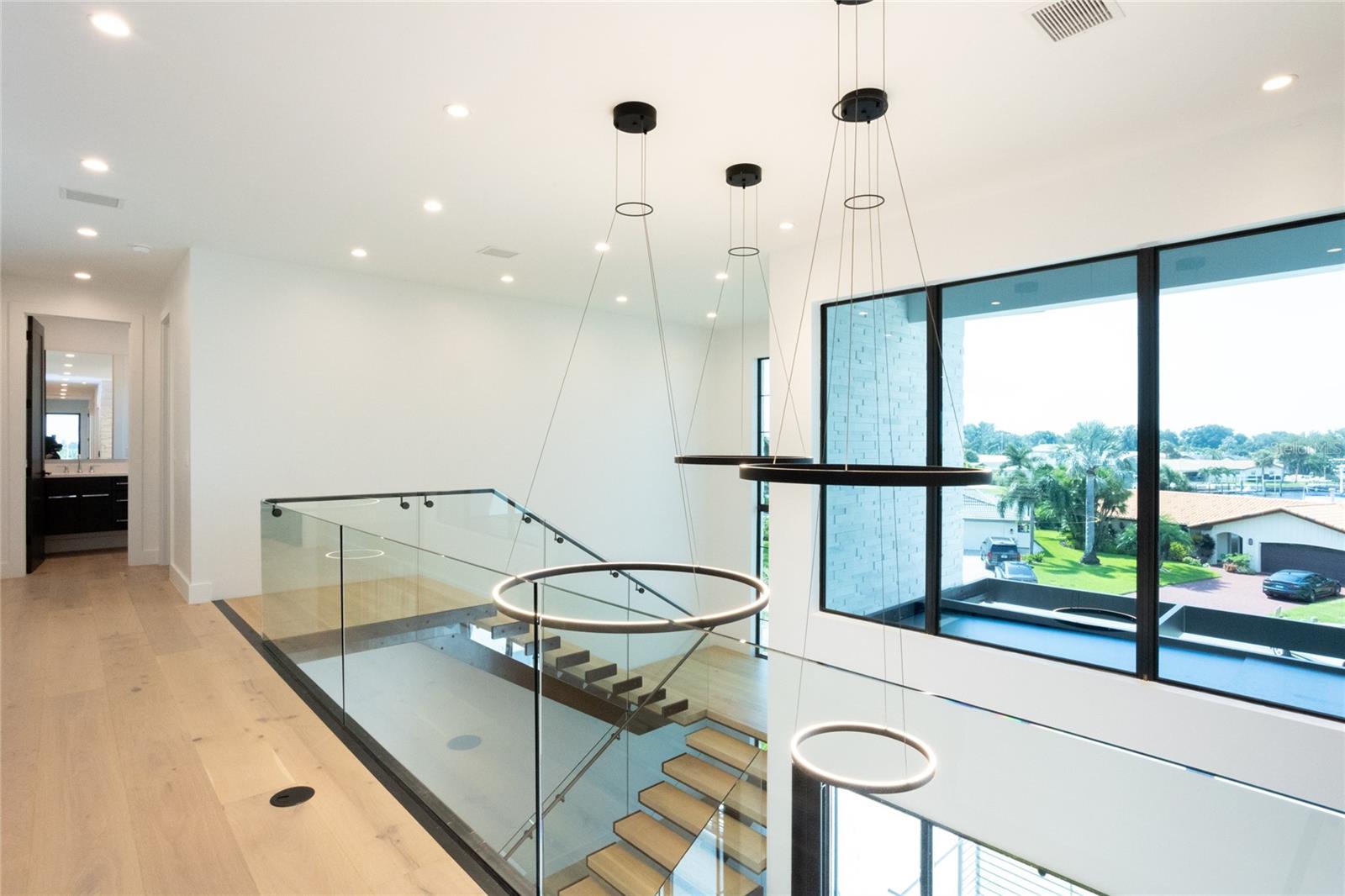 Seamless glass at the top of stairs for a sleek and modern look