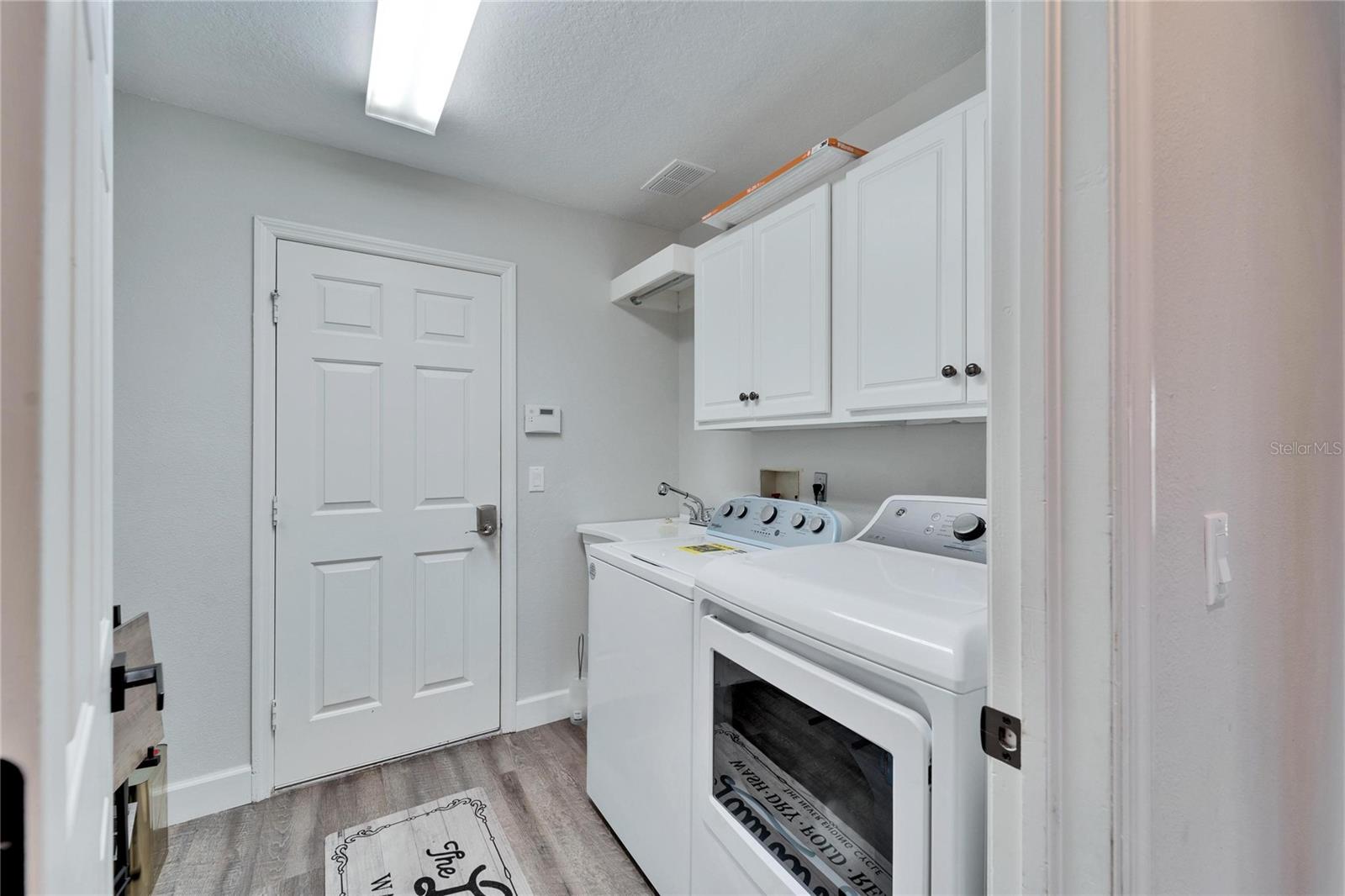 Laundry Room and entrance to the Garage