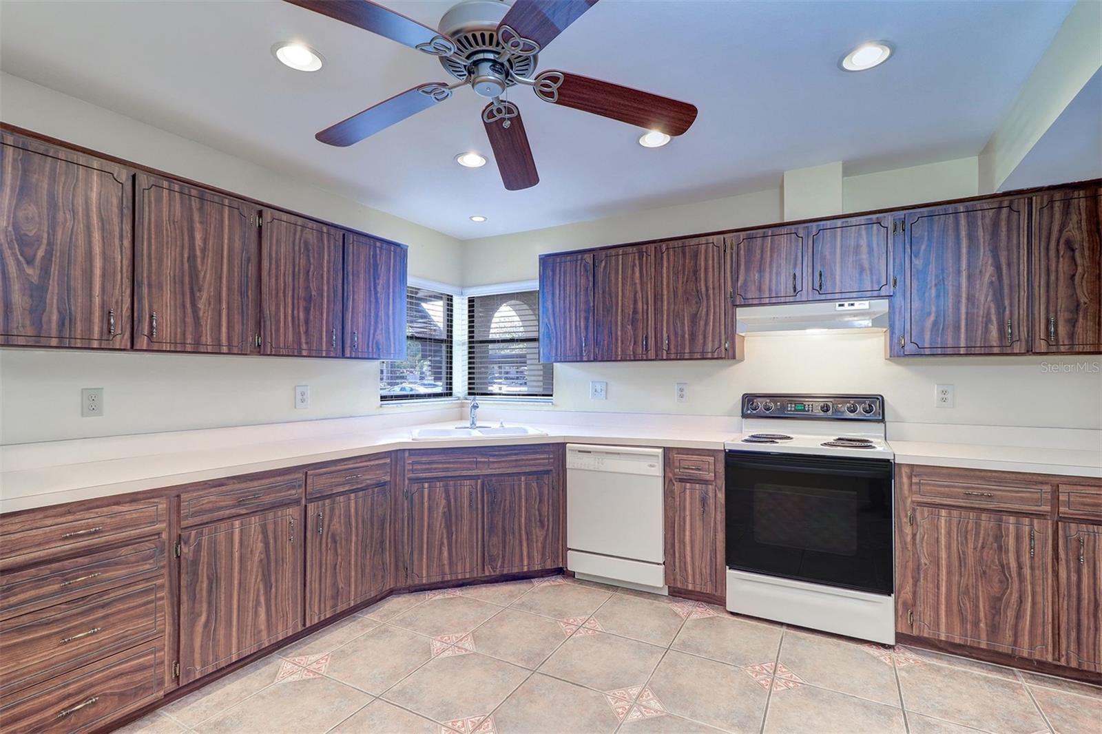 Large kitchen with corner windows over sink