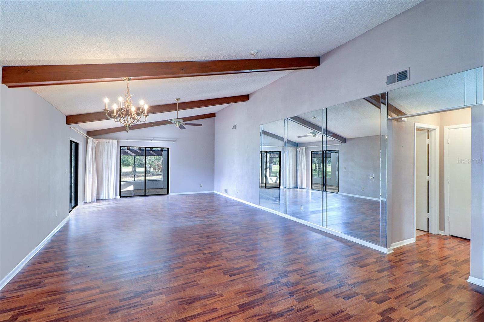 Living room with vaulted ceiling and exposed beams