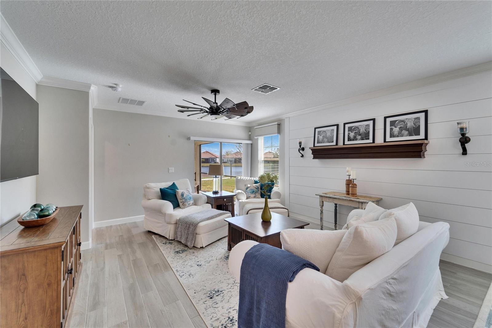 Family room with sliding glass doors to the screened lanai.