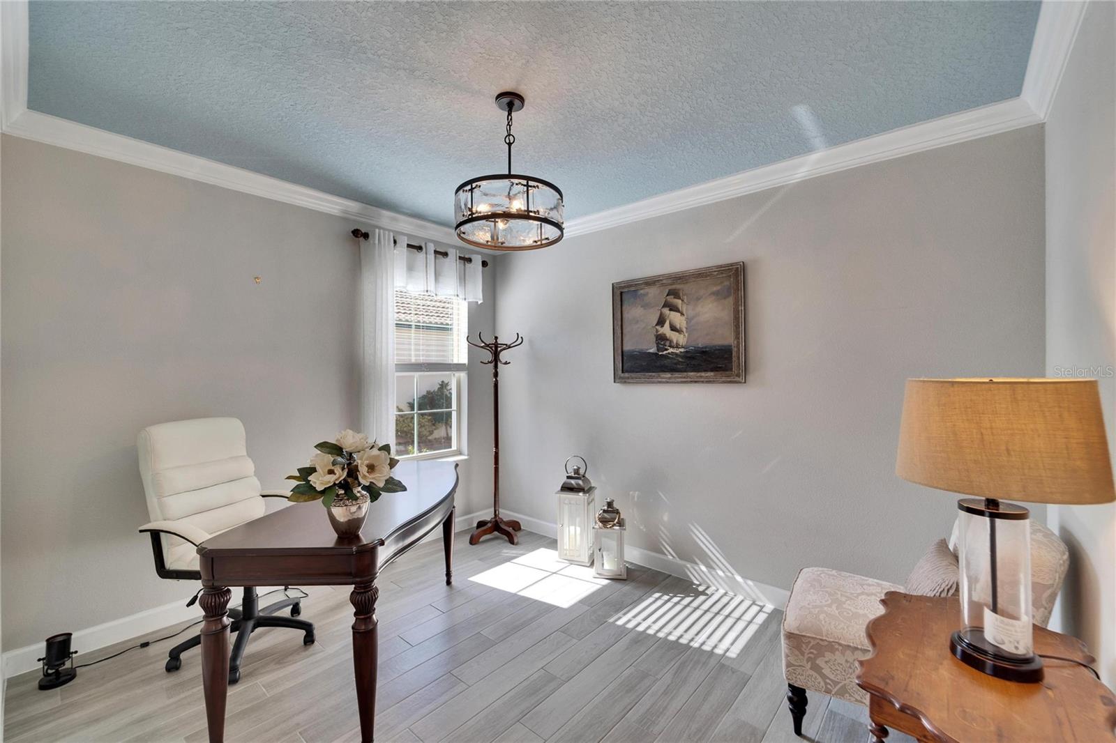 Looking into the office/ den.  All common areas have a coastal vibe ceramic plank tile.