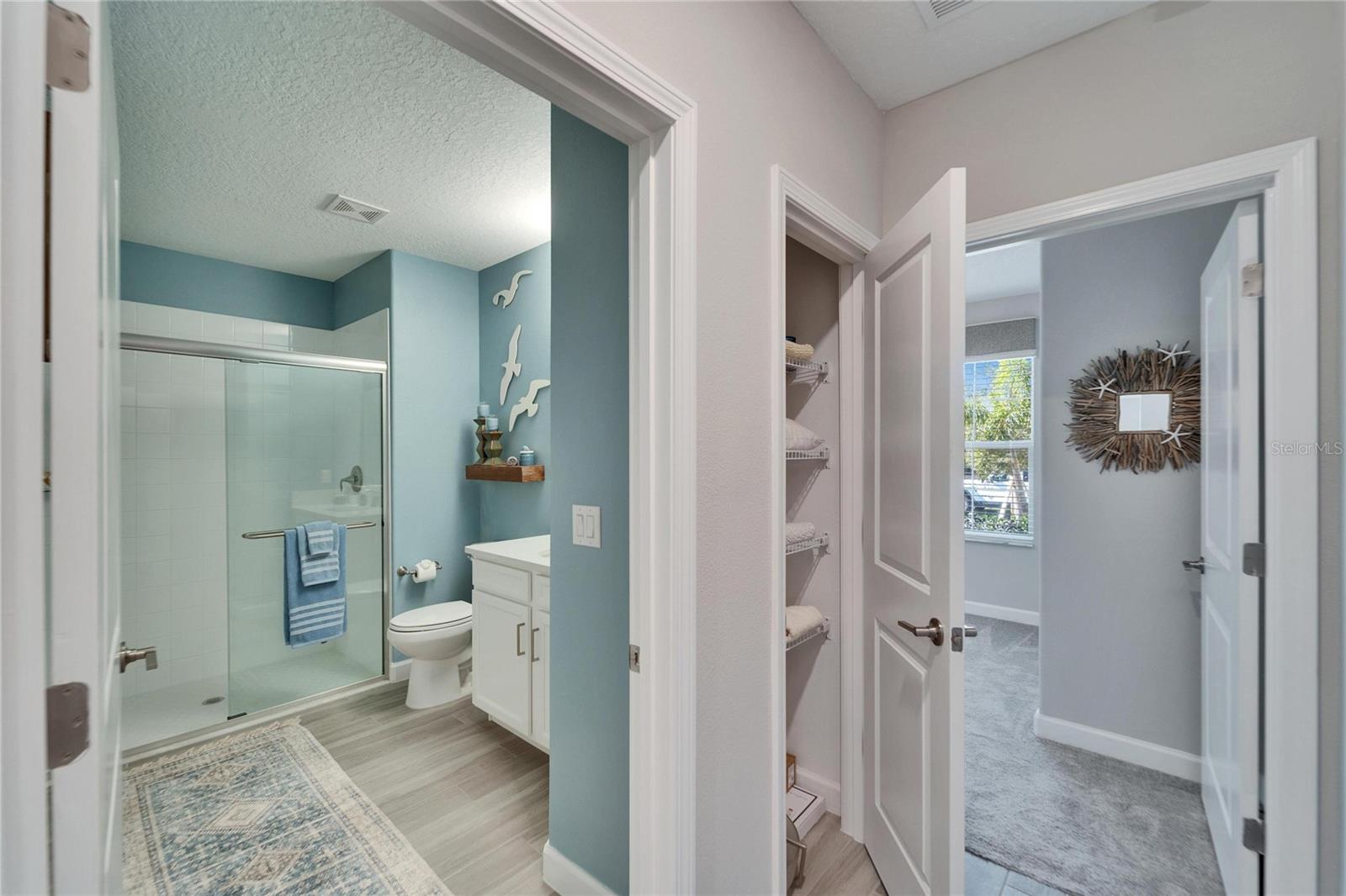 Guest bathroom, linen closet leading to the guest bedroom.