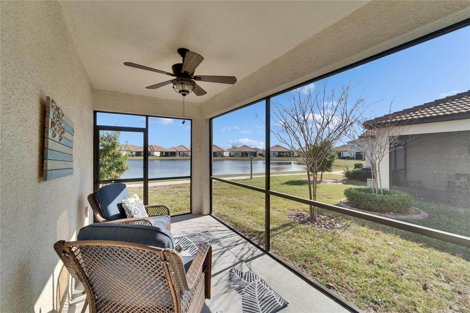 Screened lanai.  A perfect place for a morning coffee, or finish the day with a great glass of wine.  Enjoy peaceful views of the pond.