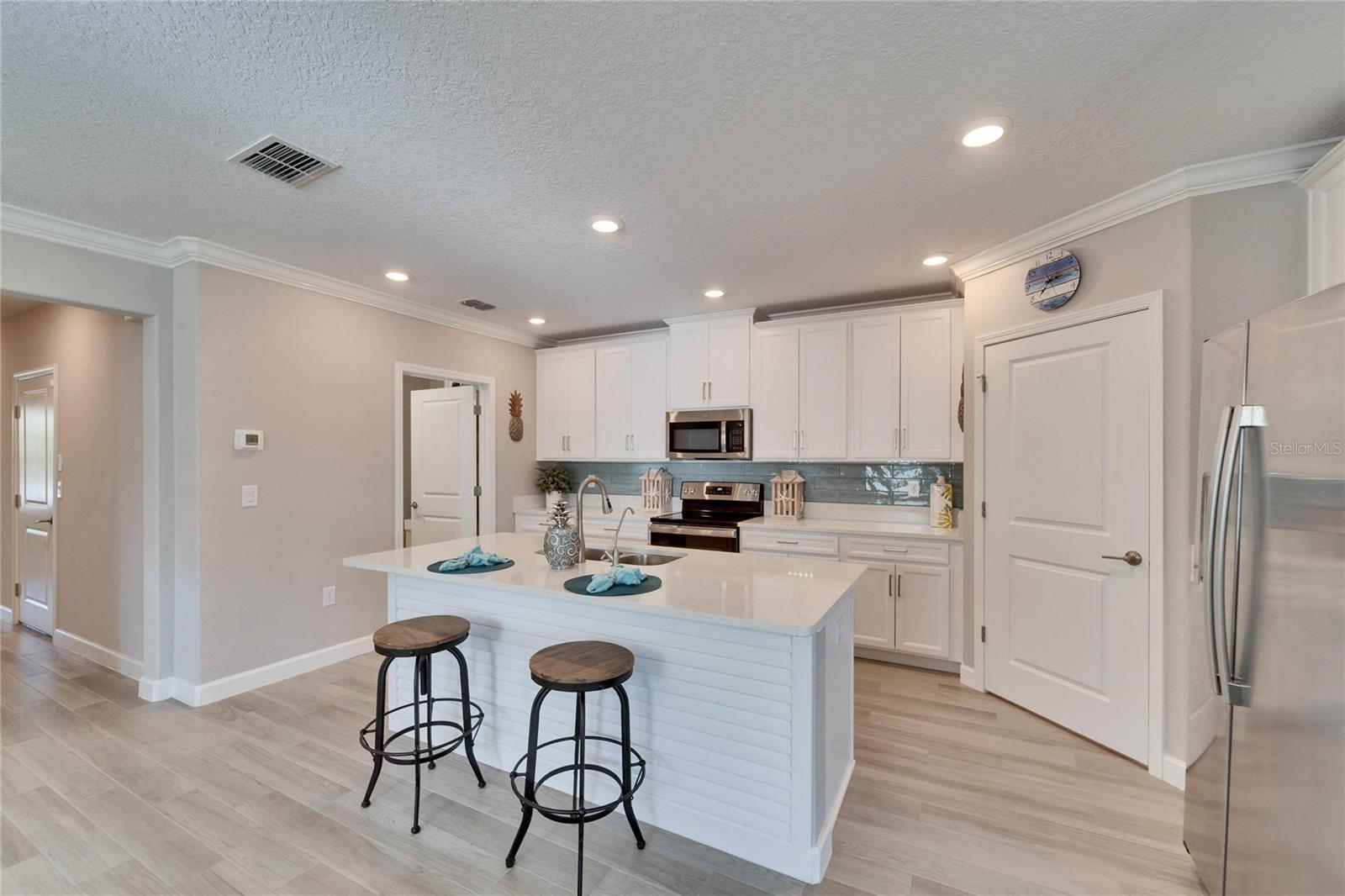 Ceramic coastal vibe with plank tile in all common areas.