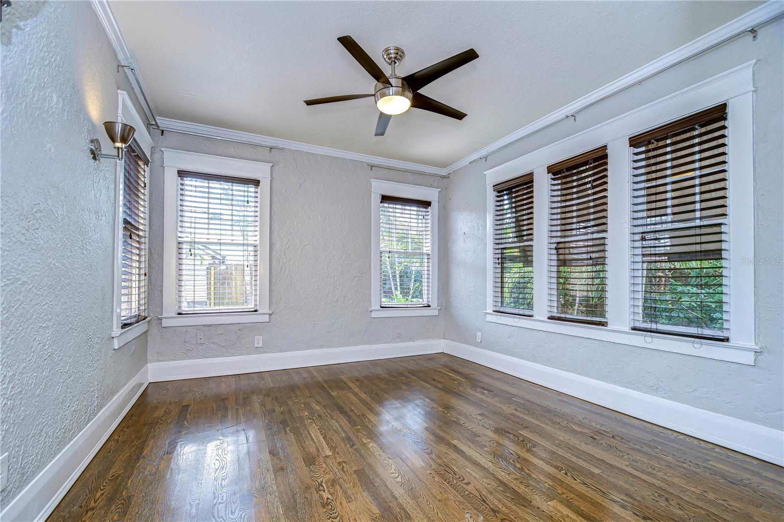 Primary suite features crown molding and high baseboards!