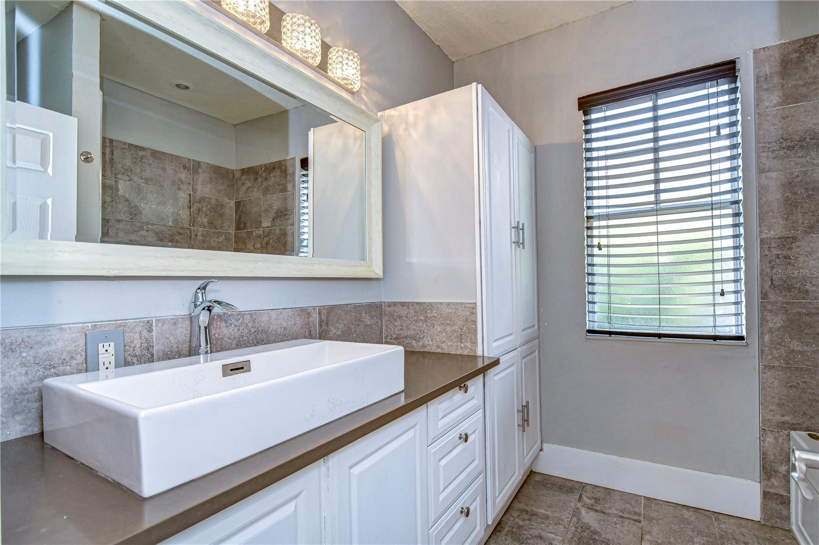 Gorgeous bathroom with plenty of cabinetry space!