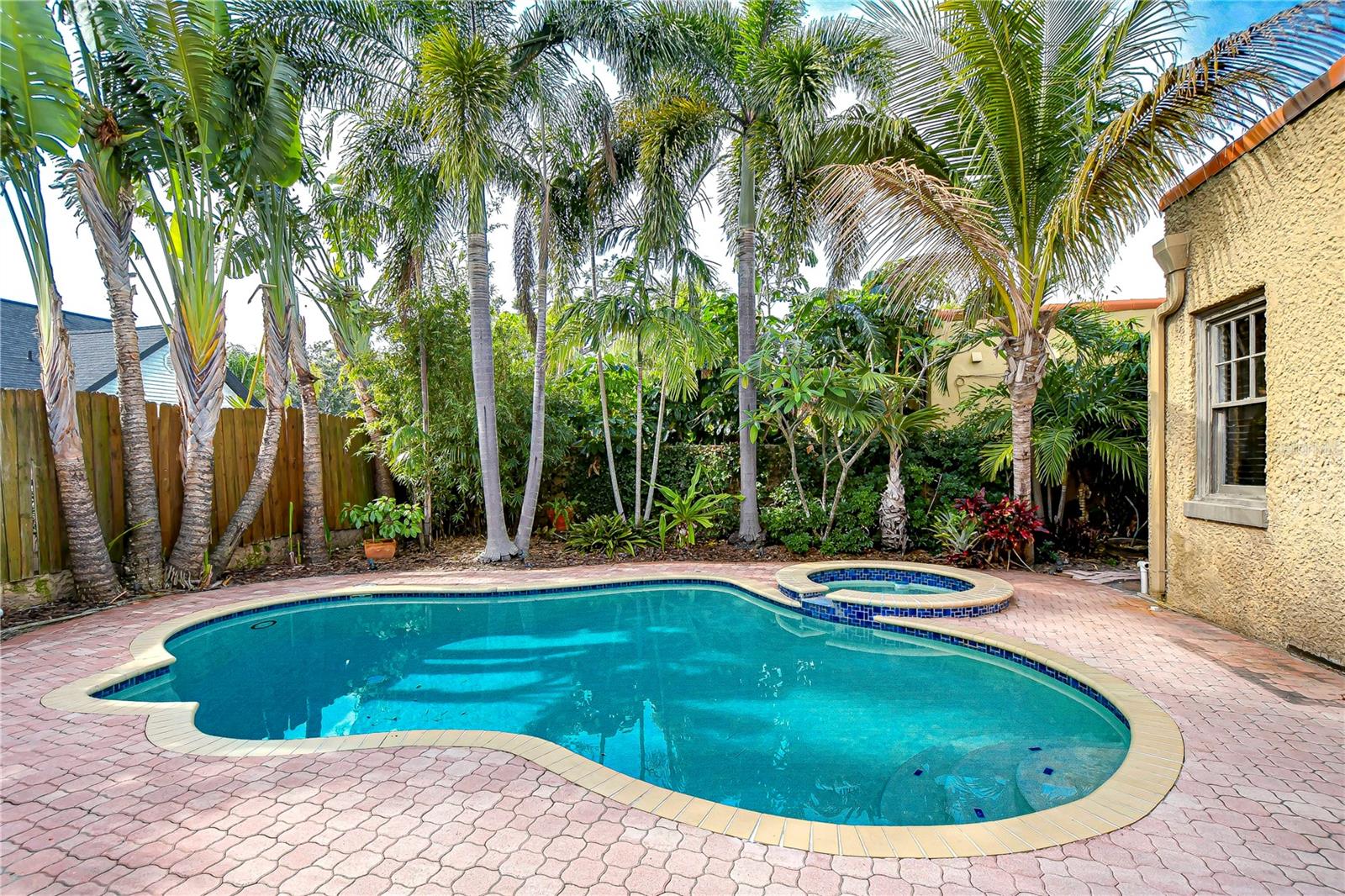 Towering palm trees offer you a tropical oasis while you relax in the pool!