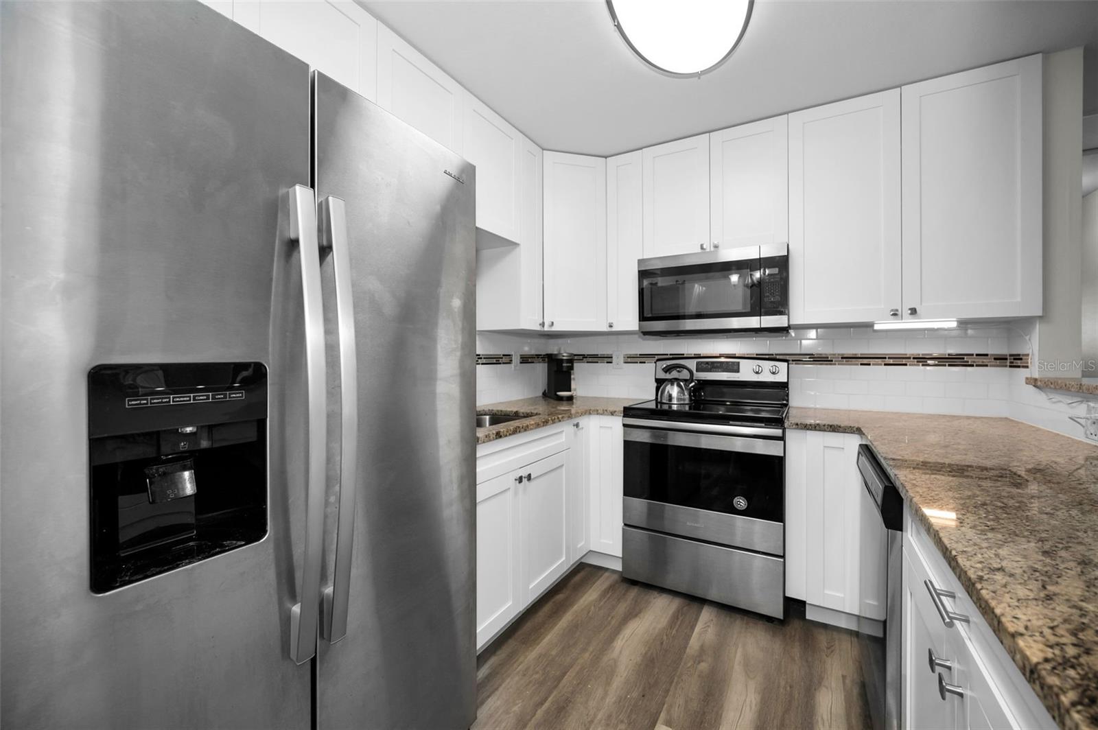 Modern Kitchen with stainless appliance package.