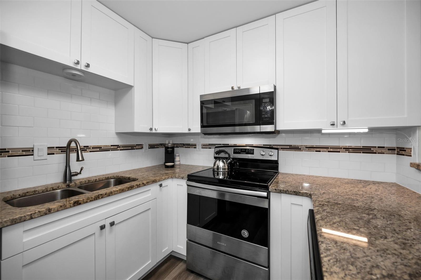 Light & bright remodeled Kitchen. The size & layout make cooking a breeze!