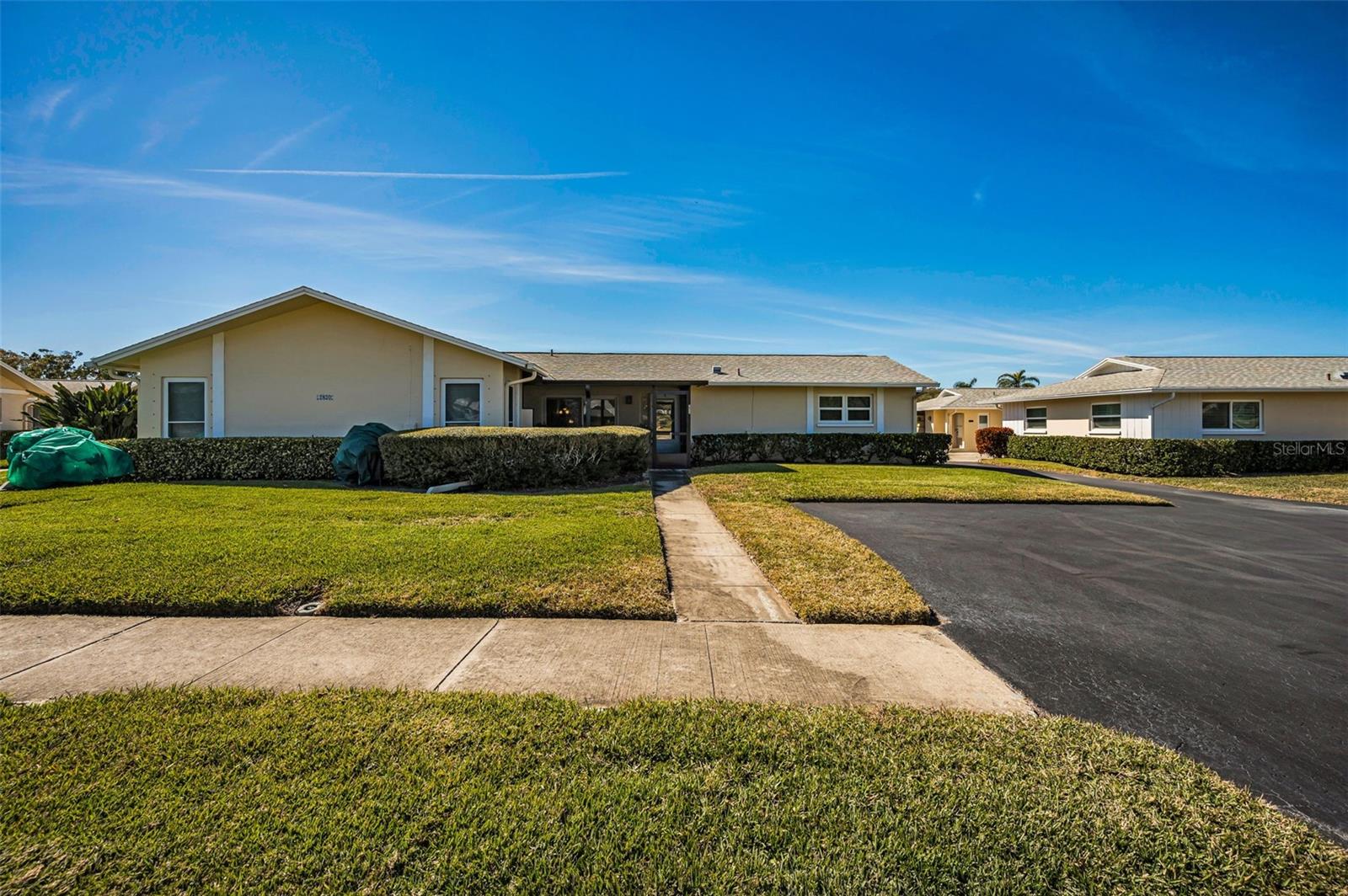 Enjoy morning coffee on your NEW front Screened Lanai! Condo fee covers all exterior lawn & building maintenance.