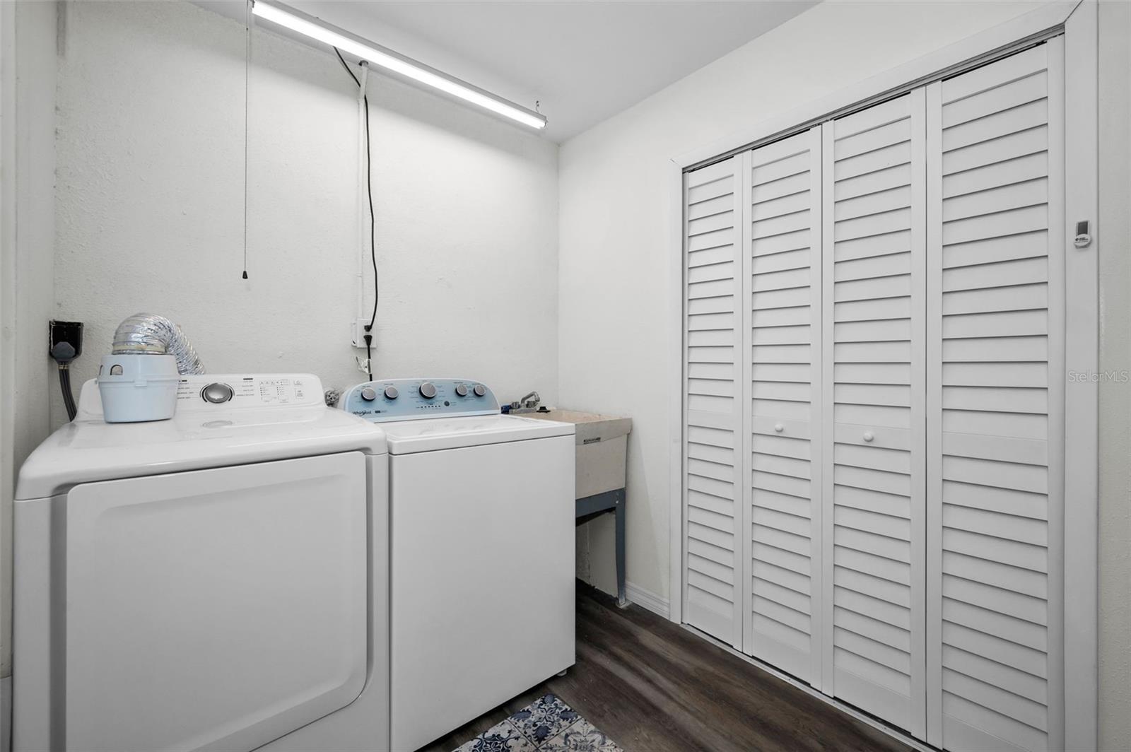 Included Washer & Dryer and Laundry Tub. Storage closet on the right houses the Water Heater.