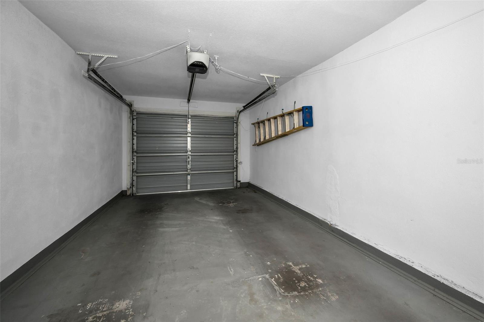 Oversized 1-Car attached Garage with automatic Chamberlain Door Opener.