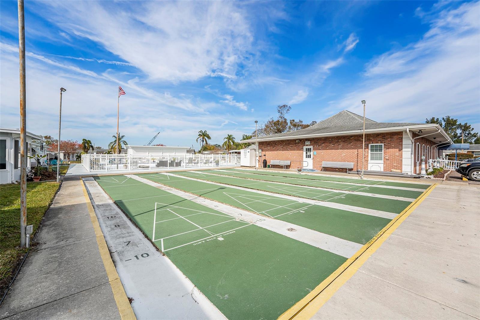 Clubhouse, laundry, heated pool, sauna, fitness center, and shuffleboard