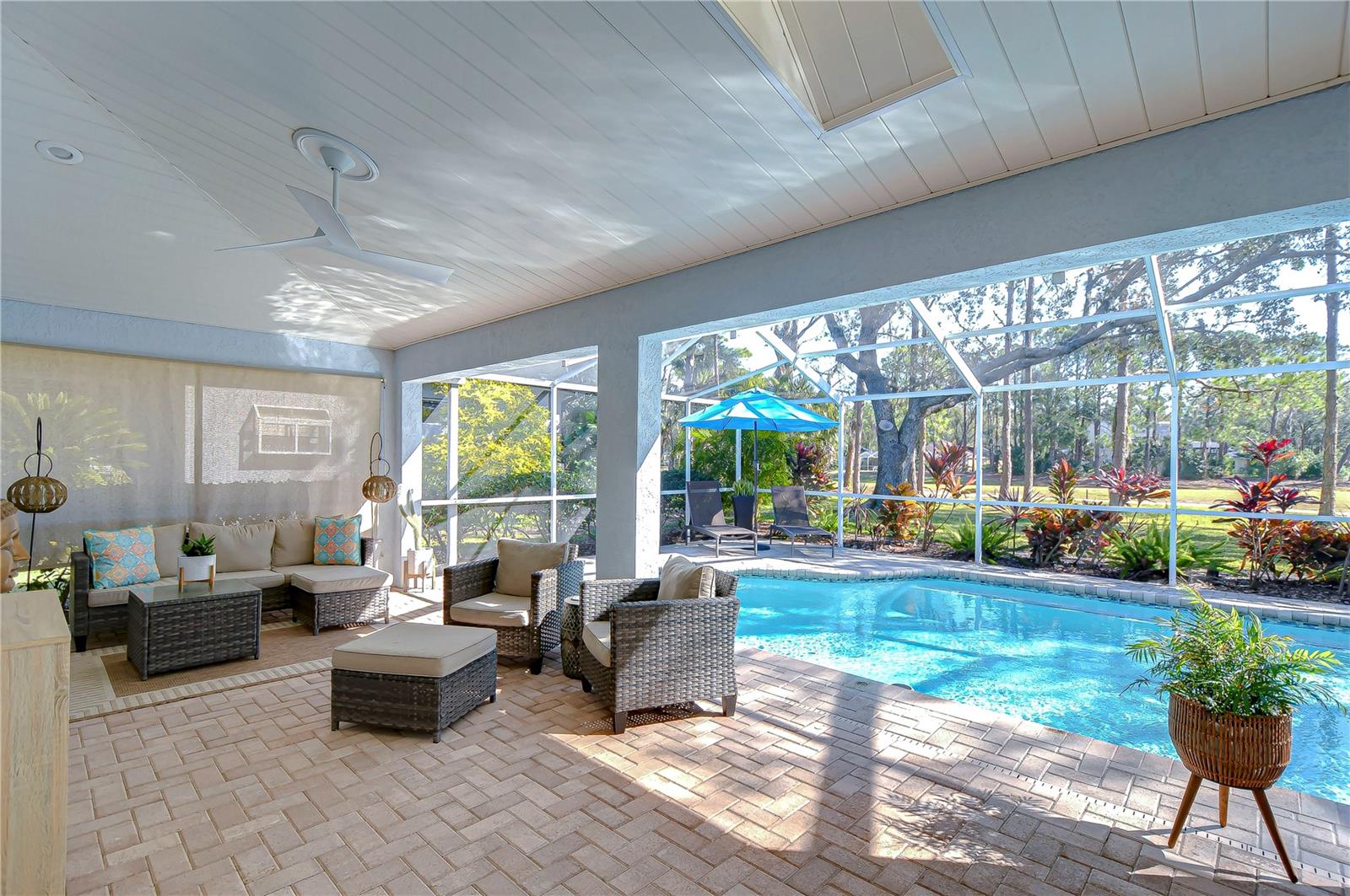 Enjoy views of the glistening pool and the mature oak trees!