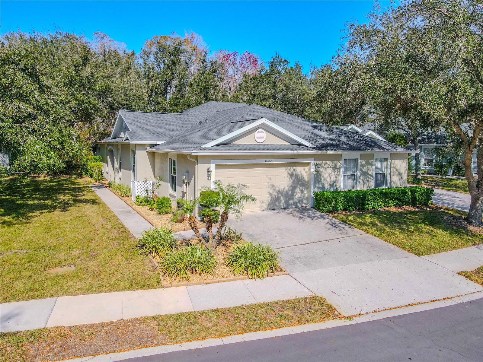 MOVE IN READY: 2 Bedroom, 2 Bath, + Office, 2 car Garage, and Screened in Lanai in gated Westmont Oaks.