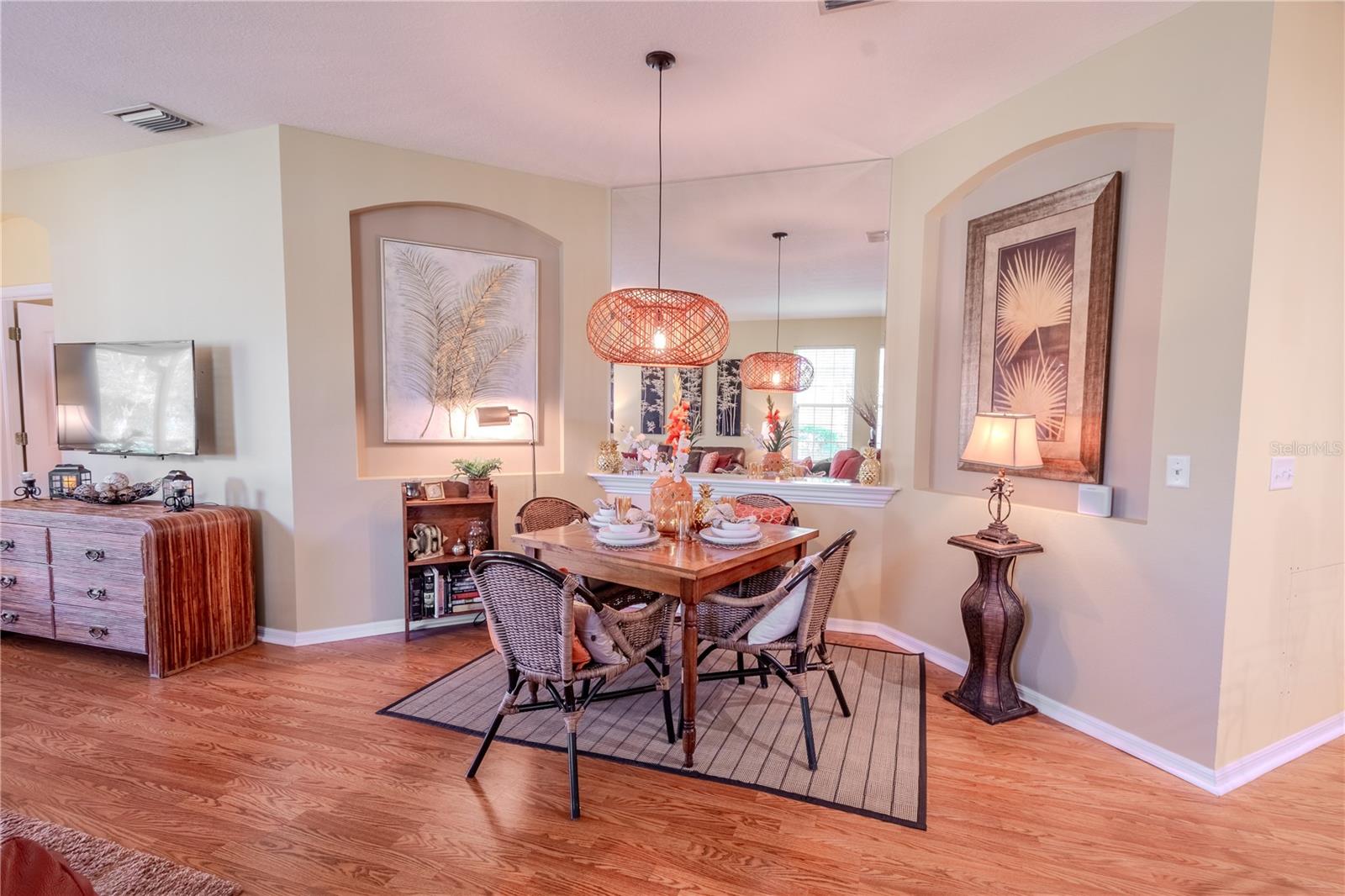 Wood laminate flooring throughout the home. The dinette features a bamboo chandelier and architectural details for your artwork.