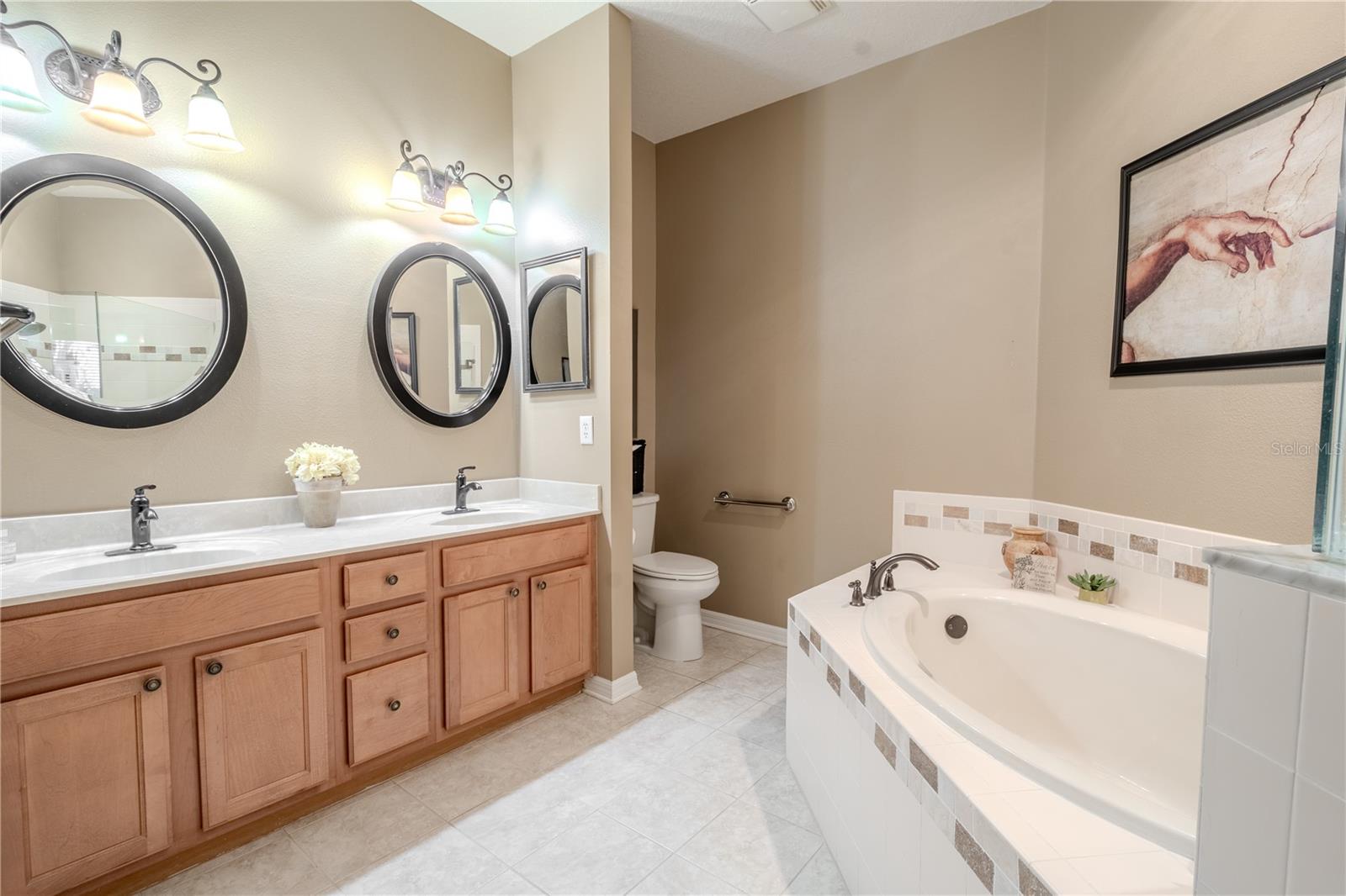 The primary bath features a ceramic tile floor.