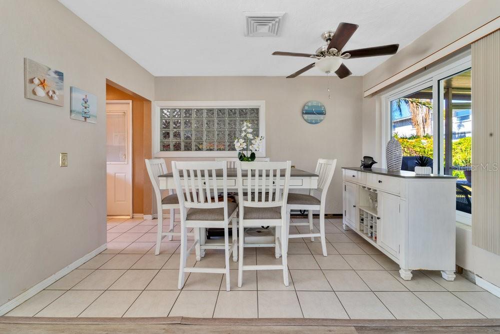 Dining area with kitchen and garage entrance