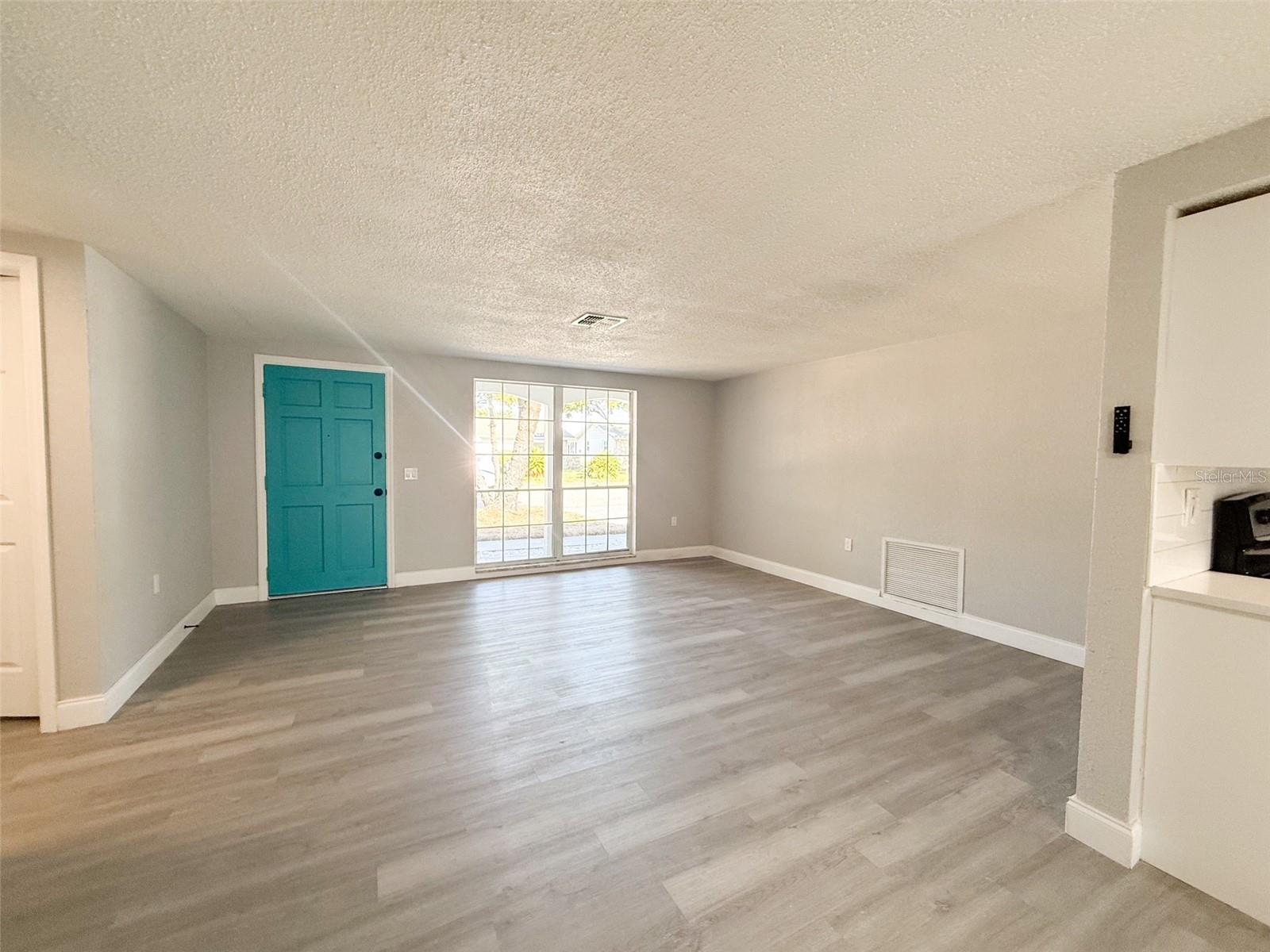 From the dinette area looking at the living room.