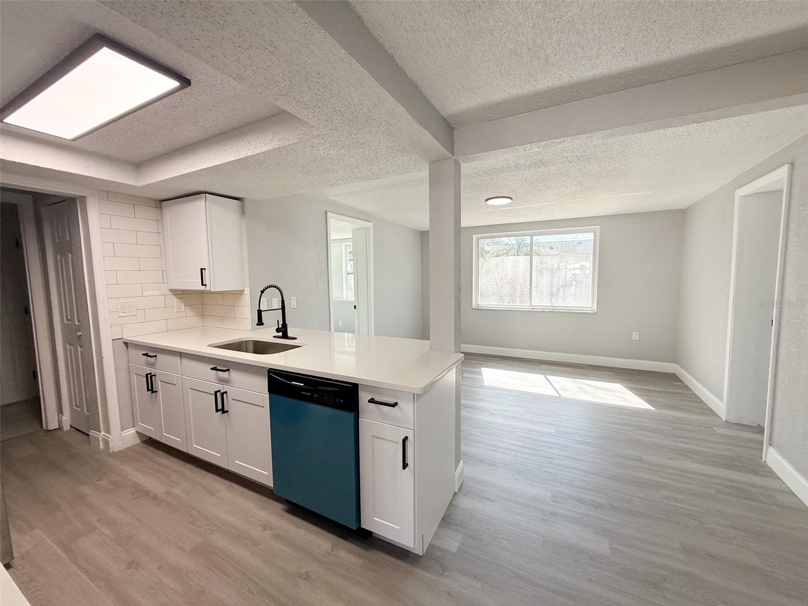 Quartz countertop and breakfast bar.