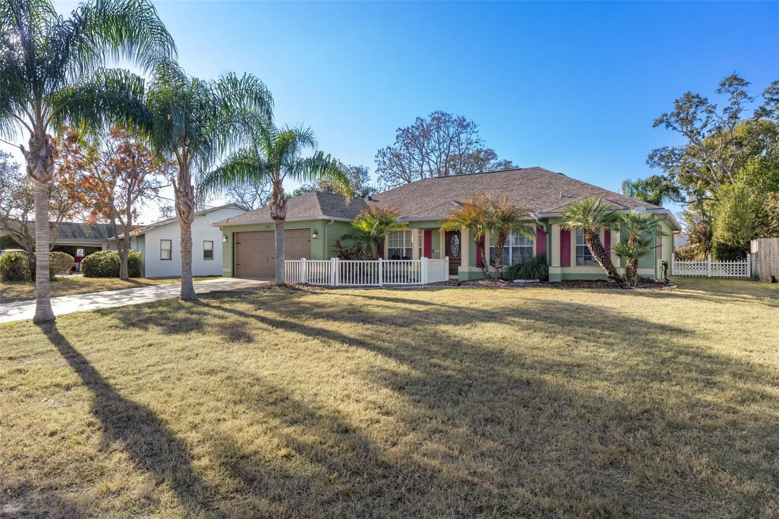 The home has a lovely front yard, Notice the lush landscaping