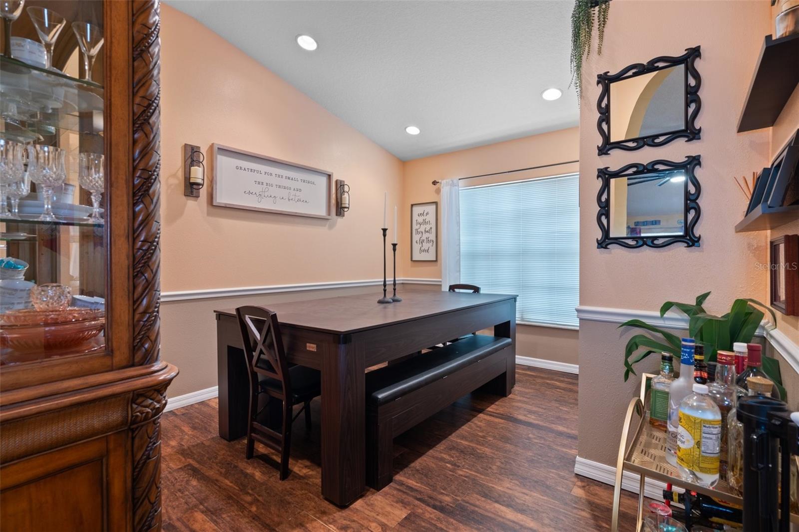 The formal dining room is an enclosed space, this could be used as a home office also