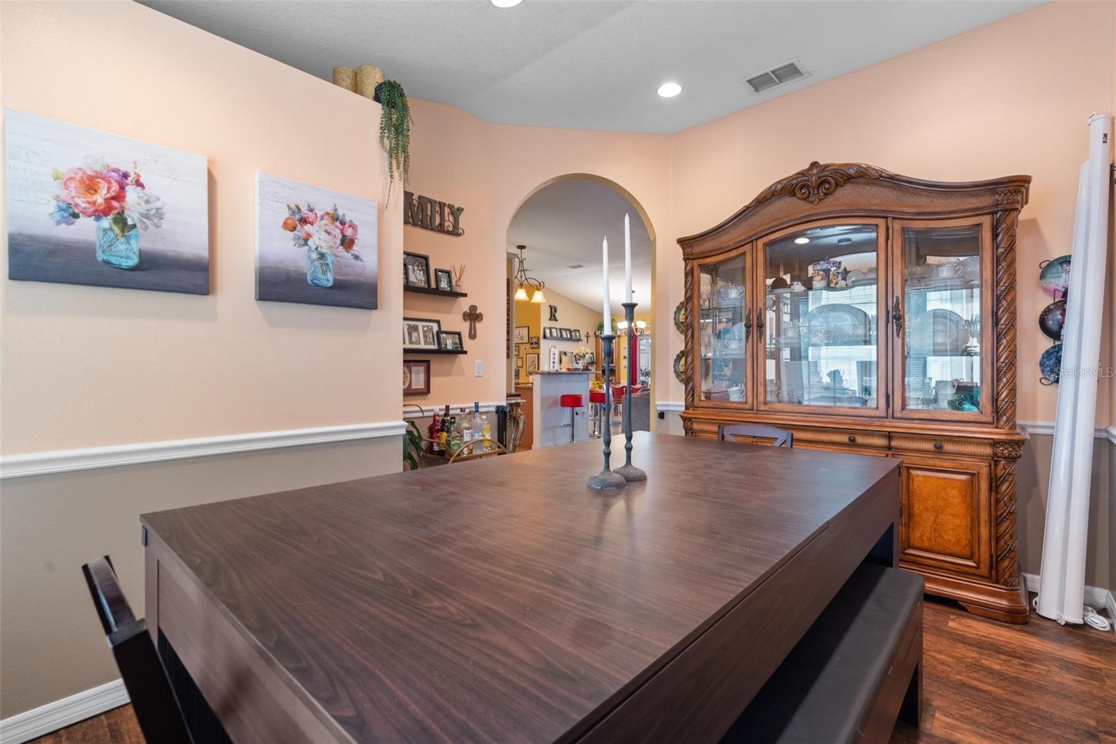 Notice the beautiful moldings on the wall in the formal dining room