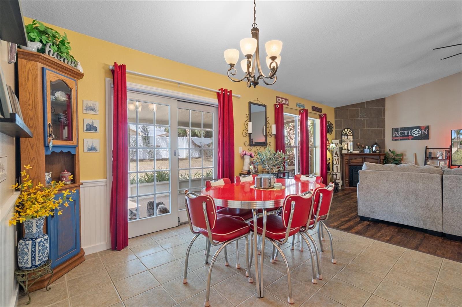 Notice the Sliding Glass Doors from the Dining Area to the Screened Porch