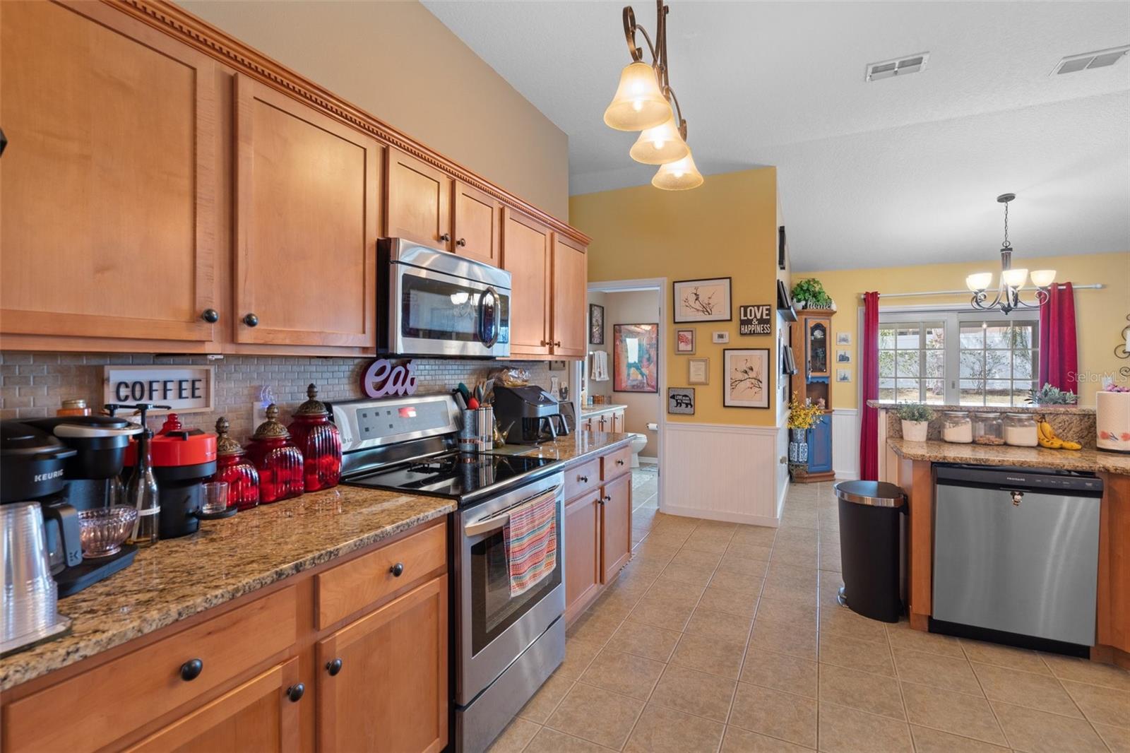 Wow what a Beautiful Kitchen !! Notice the abundance of cabinets and granite counter tops