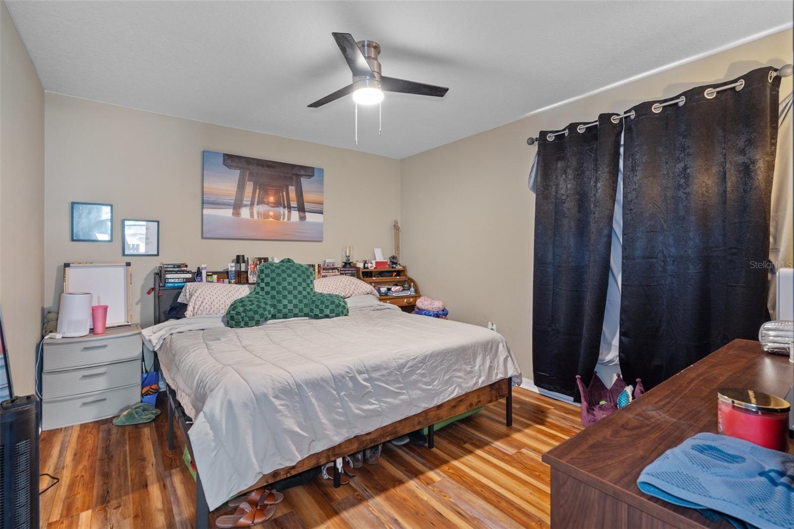 The guest bedroom is a relaxing space with a walk-in closet