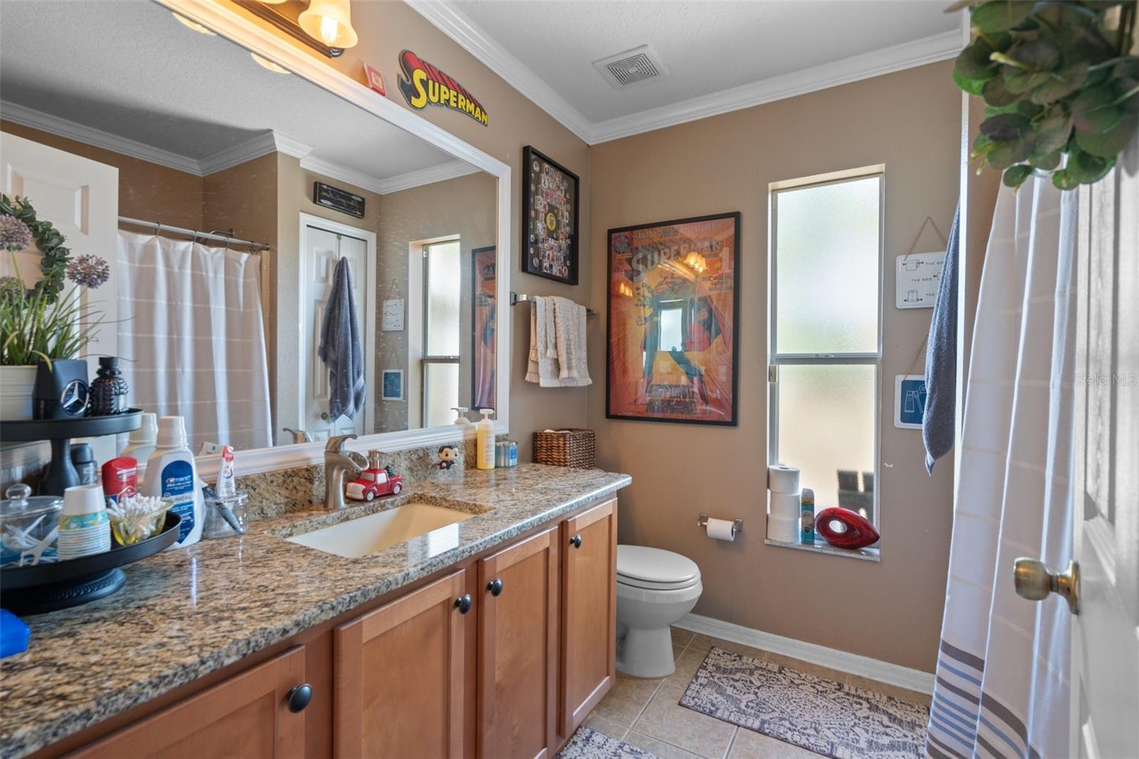 The Guest Bathroom has a vanity with a Granite Top