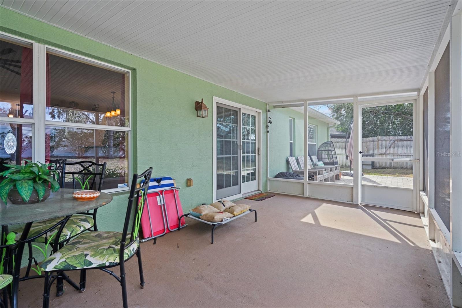 This screened in porch is the perfect place to relax with a glass of wine or a cold beer after a long hard day !!