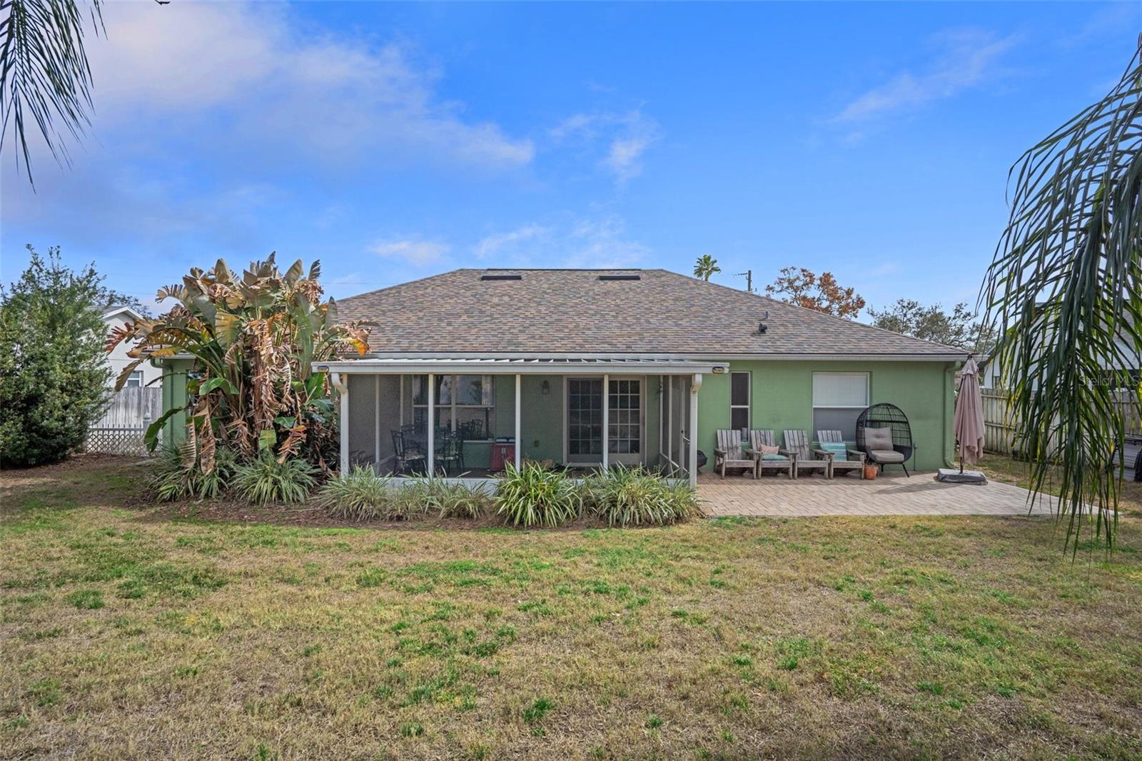 View of the screened in porch and back yard