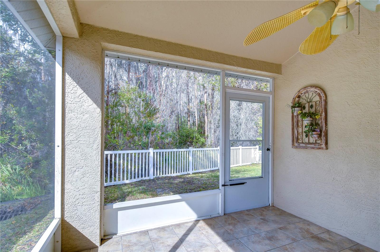 Tiled and screened, covered back porch