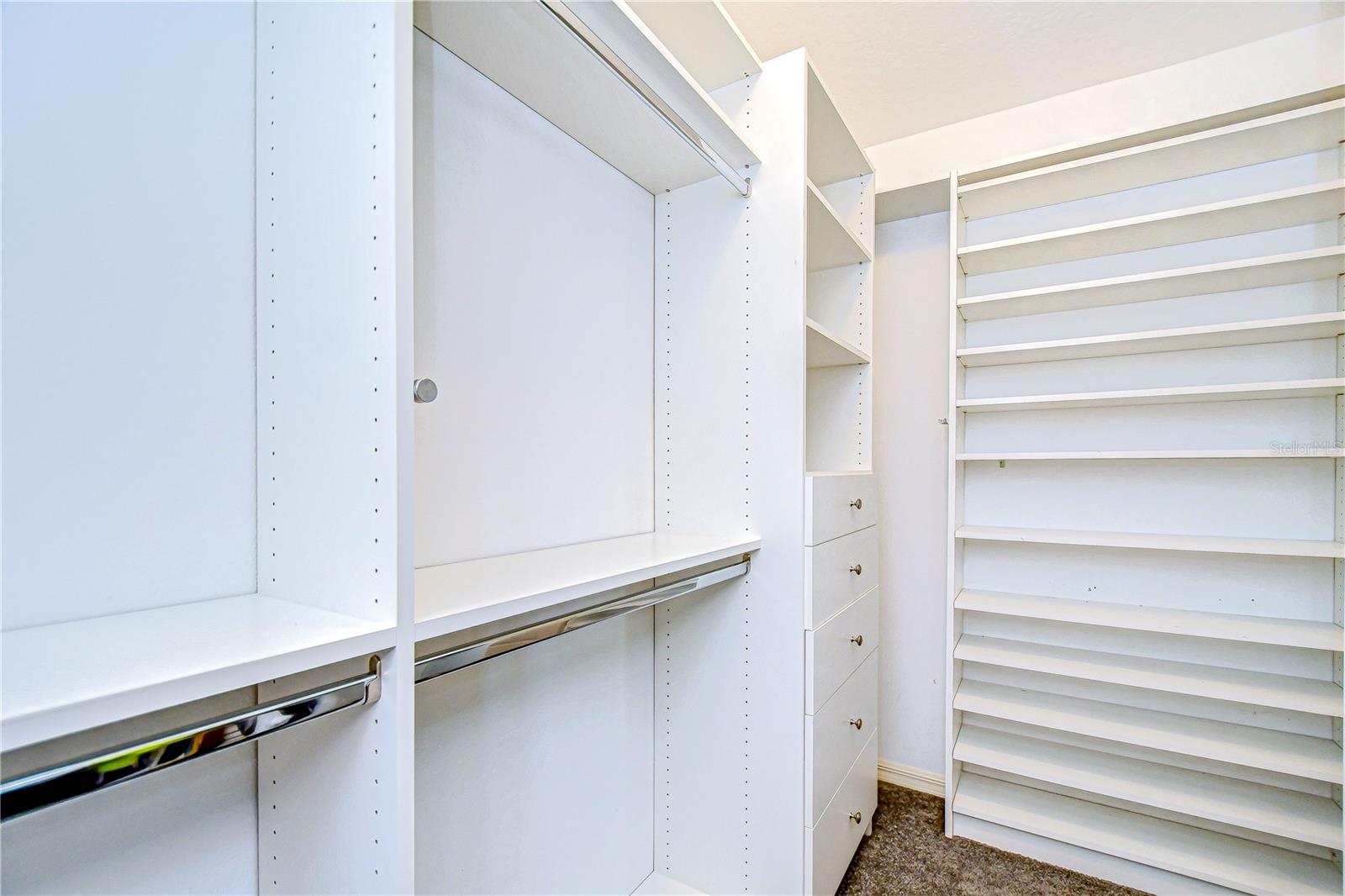 Custom closet in primary bedroom