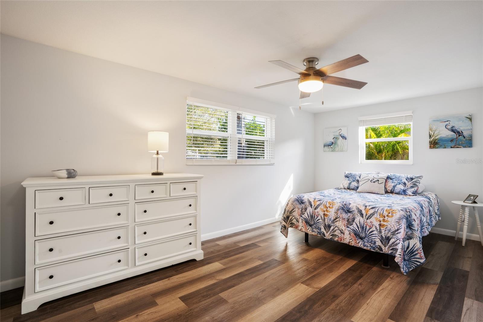 Spacious primary bedroom has a walk-in closet