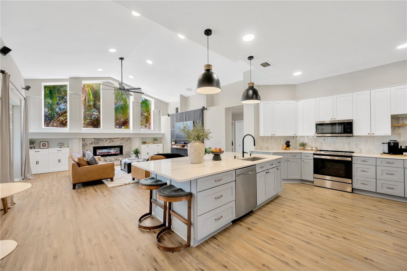 This updated kitchen is a Pinterest-worthy chef’s dream and the family room is designed for both style and comfort, with custom cabinetry framing a stunning and practical built-in decorative fireplace