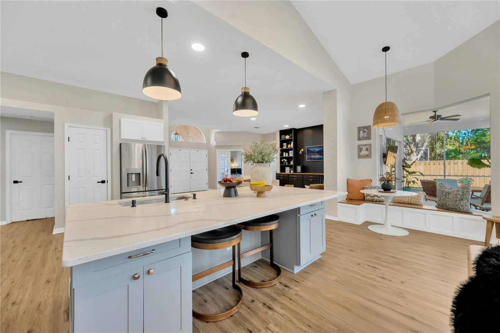 There is upgraded pendant lights and a cozy casual dining area with built-in seating under the large aquarium glass window overlooking the lanai.