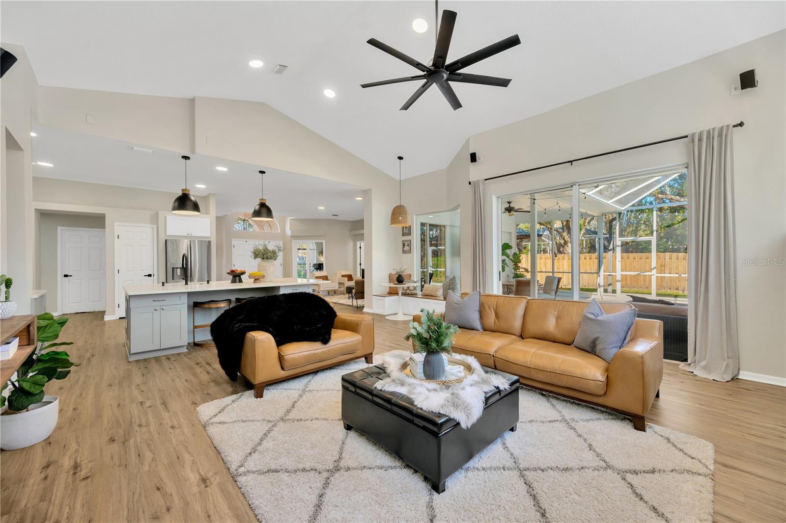 View of Family room & kitchen from fireplace wall.