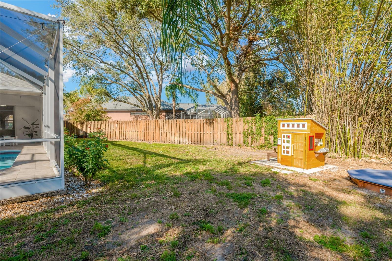 The home sits on an over-sized pie-shaped completely fenced lot.  The playhouse and sandbox as well as a 5' x 3' storage shed will stay with the new owners.