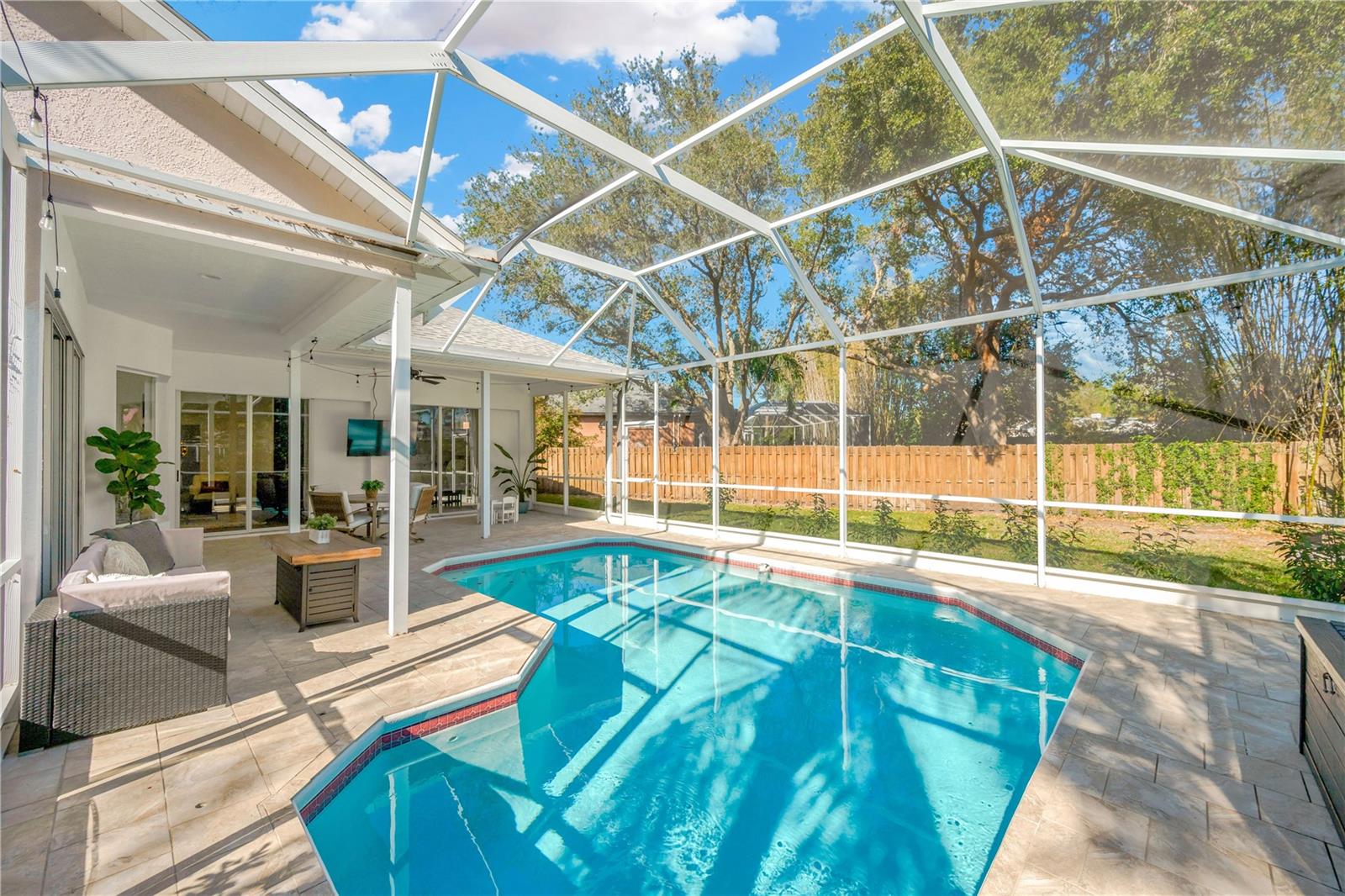 Expansive covered lanai, accessible from every main area of the home, has a large refreshing pool – perfect for relaxing or entertaining.